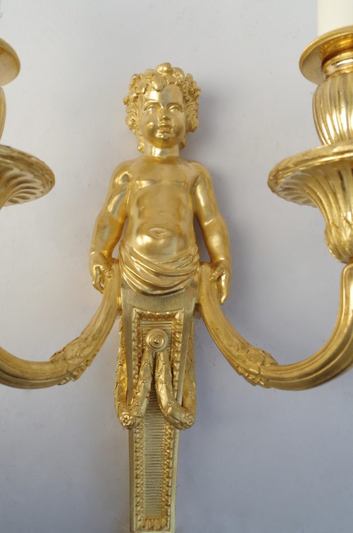 Pair of Louis XVI putti gilt bronze sconces