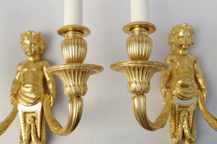 Pair of Louis XVI putti gilt bronze sconces