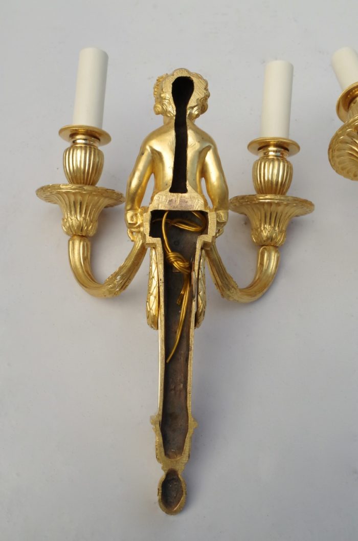 Pair of Louis XVI putti gilt bronze sconces