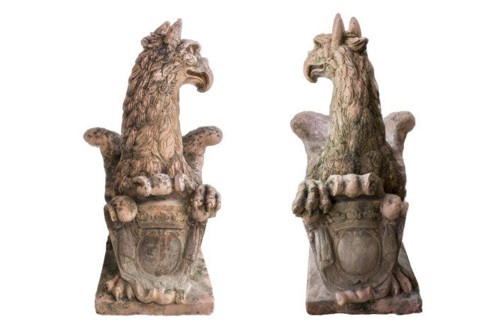 pair griffins chimeras stone shield face