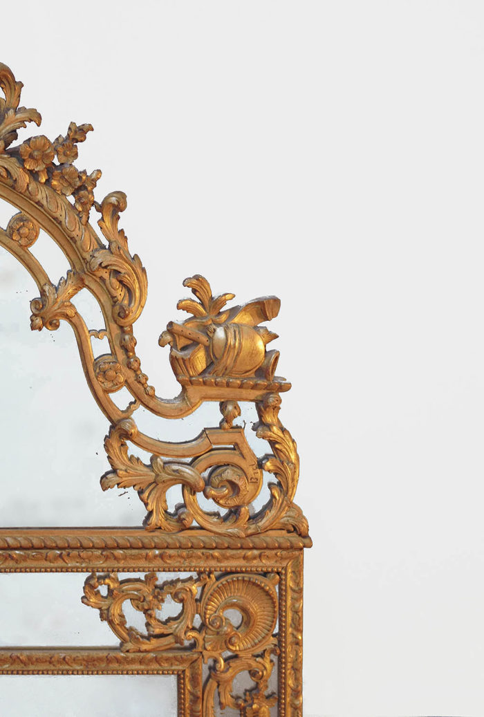 glazing beads regence style mirror pediment scroll trophie