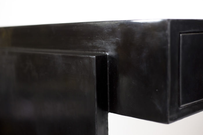curved desk black lacquered wood detail