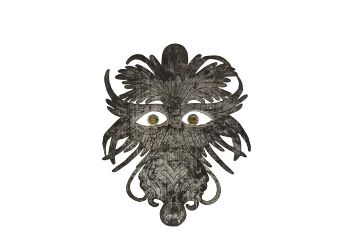 grotesque mask embossed silvered metal back