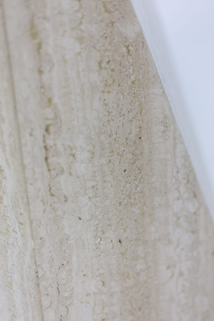 Dining table in travertine - focus