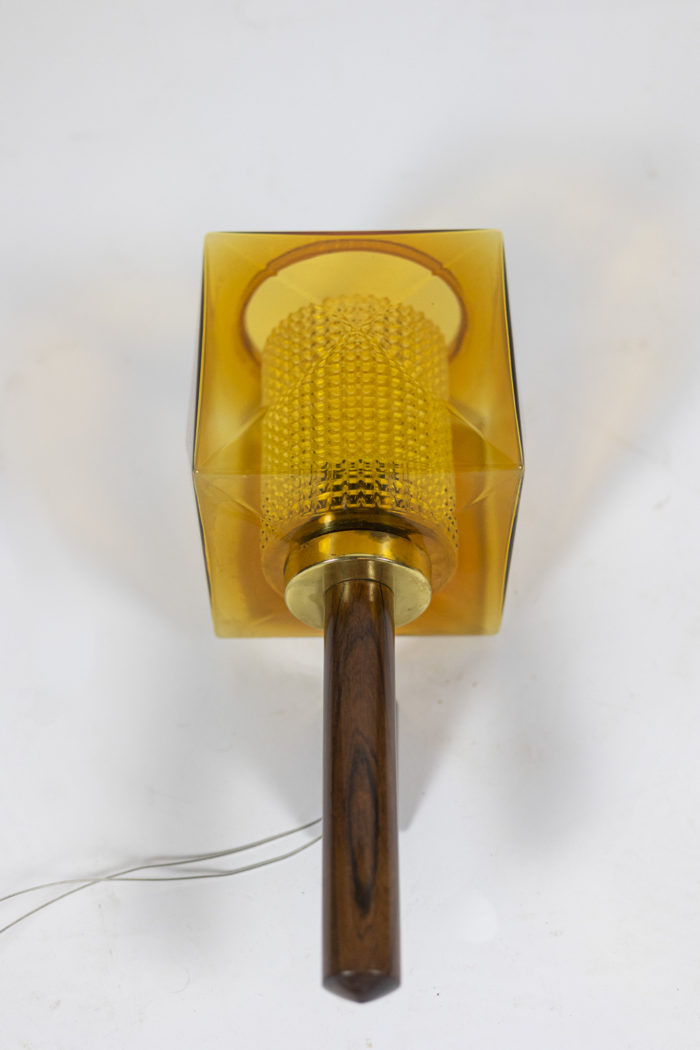 Wall sconce in rosewood and glass, rectangular in shape. Granite glass, translucent and yellow in color - other focus