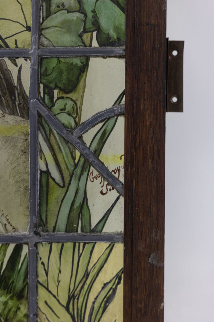Paire de vitraux à motifs floraux signés Geoffroy, fin du XIXEs armature