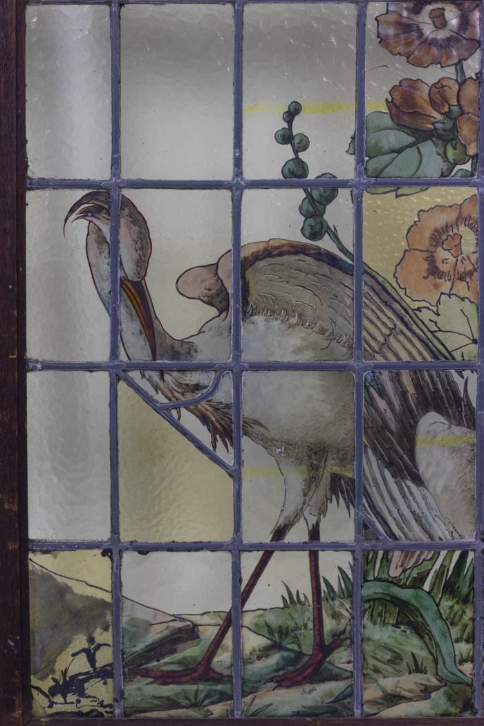 Paire de vitraux à motifs floraux signés Geoffroy, fin du XIXEs - un paon
