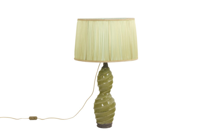 Glazed terracotta lamp, twisted shape and yellow color. - face