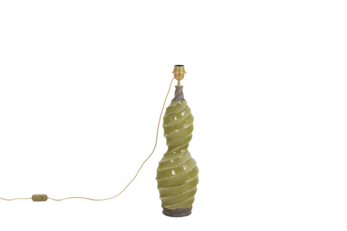 Glazed terracotta lamp, twisted shape and yellow color.