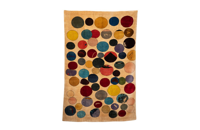 Tapis, ou tapisserie, en laine représentant des cercles colorés