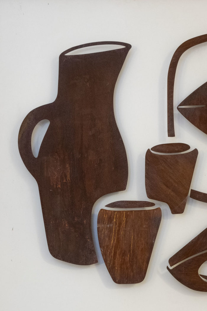 Decorative metal sign titled “Natumo”. Contemporary work. - cruche