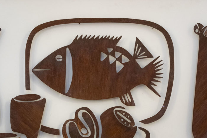 Decorative metal sign titled “Natumo”. Contemporary work. -poisson