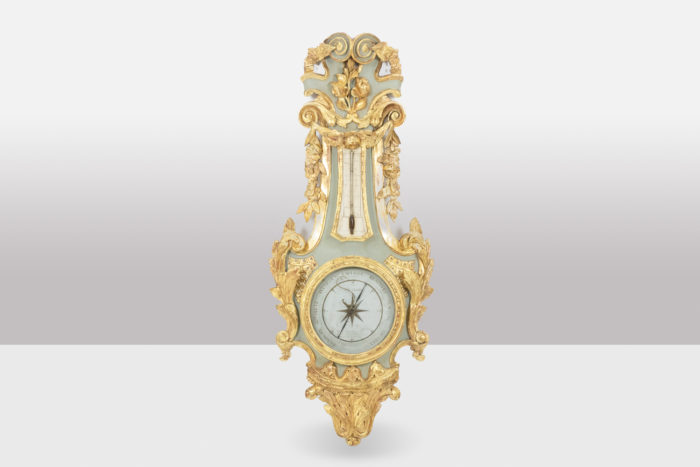 Barometer in carved and gilded wood. 18th century period.