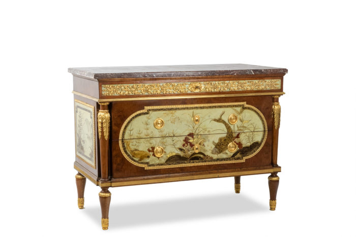 Empire style chest of drawers in lacquer, bronze and marble. Nineteenth century.