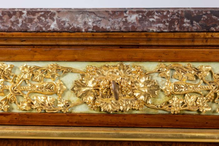 Empire style chest of drawers in lacquer, bronze and marble. Nineteenth century.