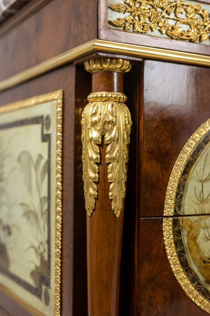 Empire style chest of drawers in lacquer, bronze and marble. Nineteenth century.