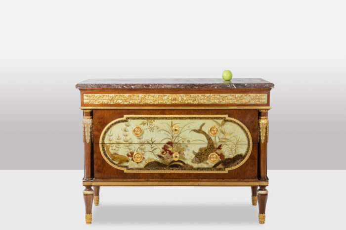 Empire style chest of drawers in lacquer, bronze and marble. Nineteenth century.