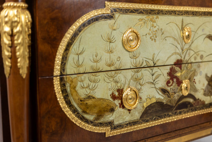 Empire style chest of drawers in lacquer, bronze and marble. Nineteenth century.