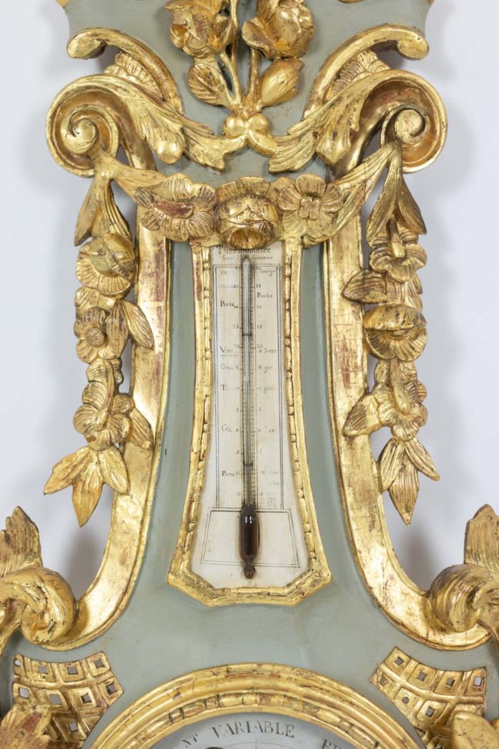 Barometer in carved and gilded wood. 18th century period.