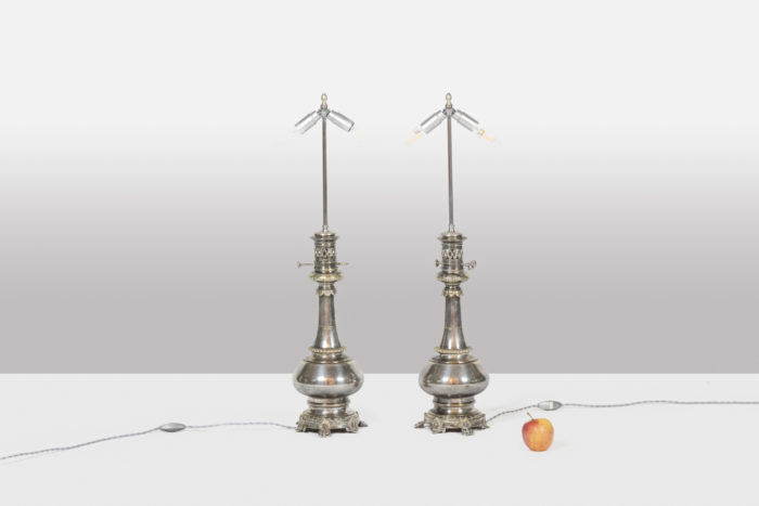 Pairs of lamps in metal and silvered bronze. Circa 1880.