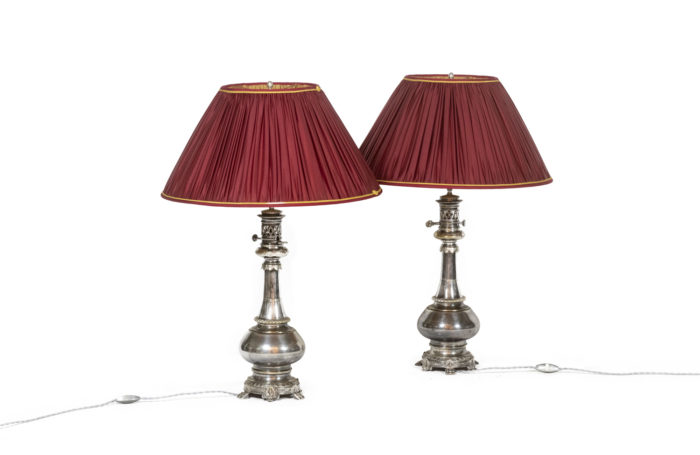 Pairs of lamps in metal and silvered bronze. Circa 1880.