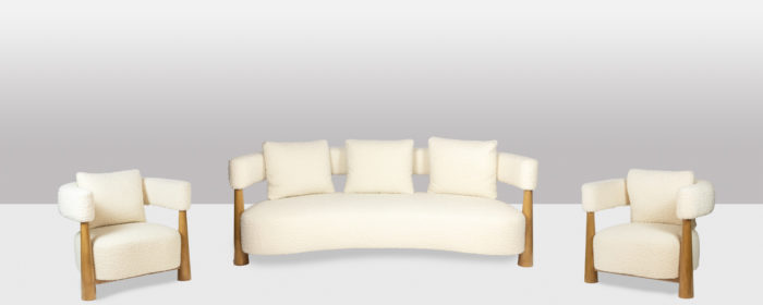 Pair of "bean" shaped armchairs, in blond beech. Contemporary work.- the set