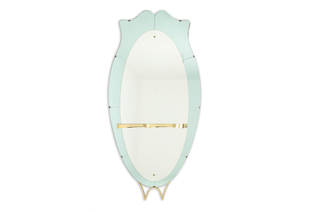 Console mirror in two-tone glass and gilded brass. Circa 1950.