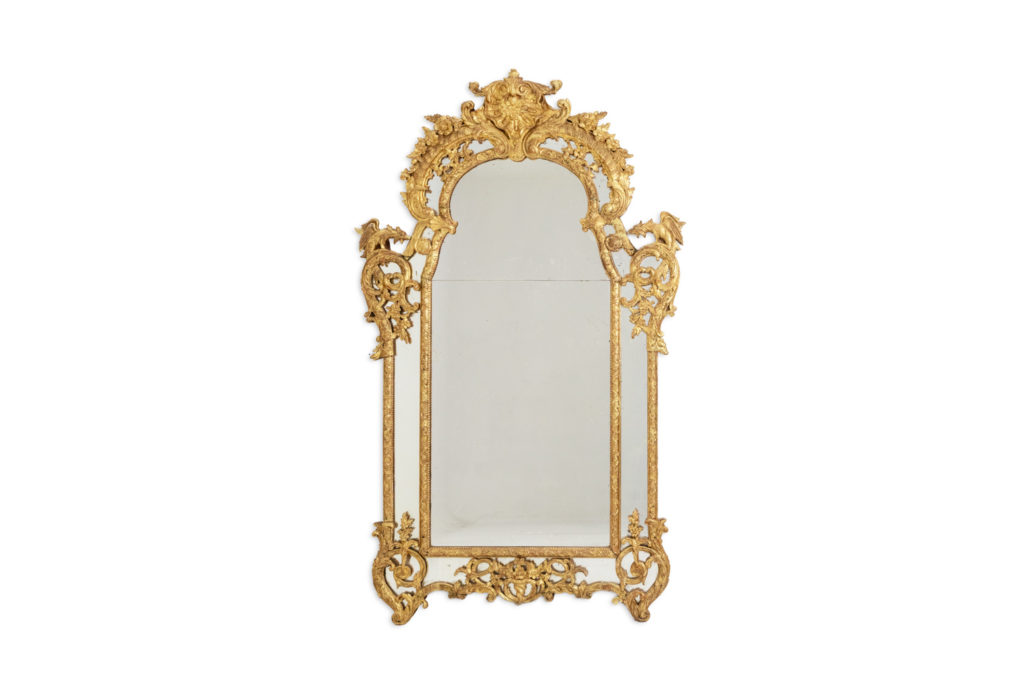 Mayfair. Large Regency style beaded mirror in carved wood. 20th century.
